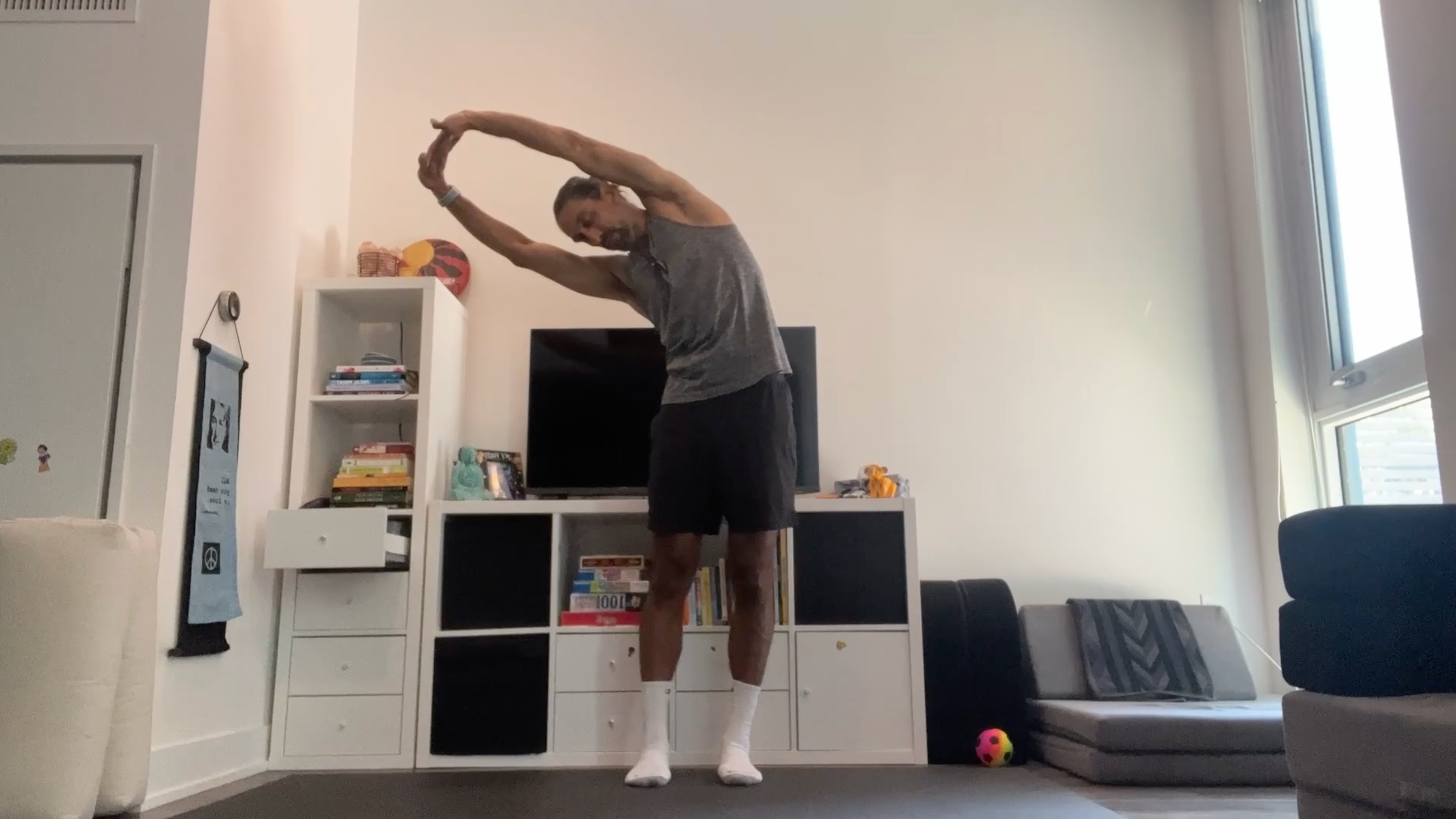 Yoga teacher Jaffer Hussain in Standing Side Stretch, part of his yoga for tech neck practice
